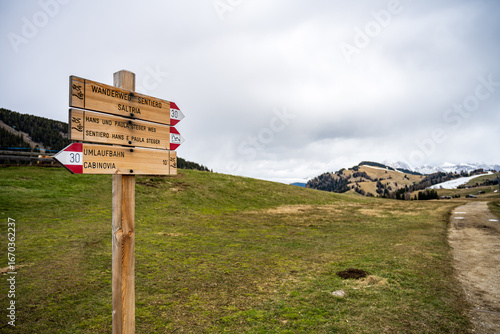 Seiser Alm, South Tyrol - Wooden direction sign reading 