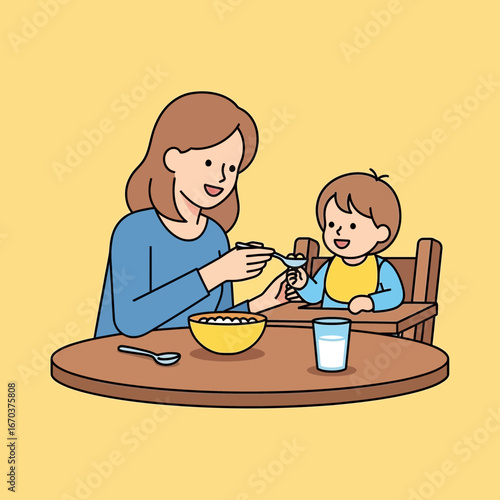 Mother feeding baby food at a table.