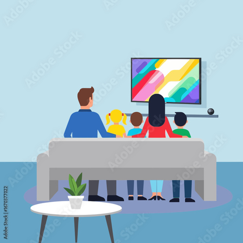 Family watches television together on a couch in a living room.