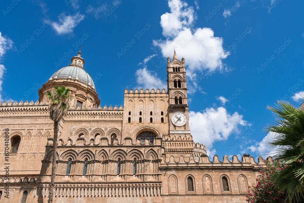 Obraz premium View of one of the four bell towers of Palermo Cathedral, featuring the only tower with a clock. Sicily, Italy