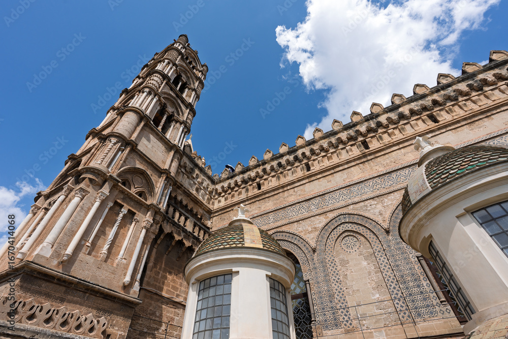 Fototapeta premium view from below of one of the four bell towers of the cathedral of Palermo, Sicily, Italy.
