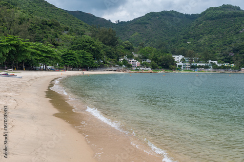 Fototapeta Silvermine Bay Beach located on Tung Wan Tau Road in Mui Wo, Lantau Island, Hong Kong