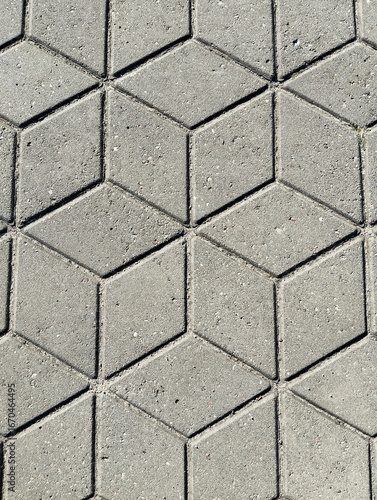 Top view of the surface texture of gray diamond-shaped paving slabs