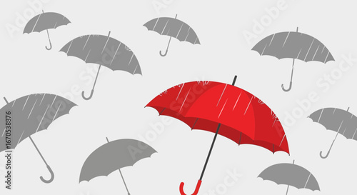 Standing out in a crowd a vivid red umbrella amidst grey umbrellas symbolizes distinction and individuality