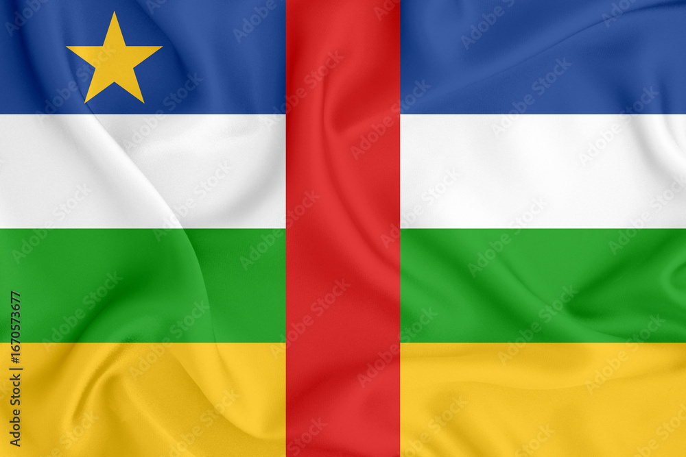 Obraz premium flag of the Central African Republic with stripes and a star on satin fabric with folds and shadows