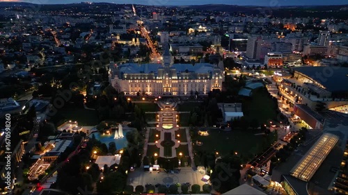 Wallpaper Mural Aerial drone footage of the Iasi cultural palace in the city of Iasi in Romania at night. Beautifully illuminated palace of culture in moldavia. High angle flyover shot of evening urban cityscape.
 Torontodigital.ca