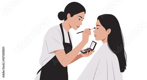 A makeup artist applies eyeshadow to a client with a brush, holding a palette in her hand.