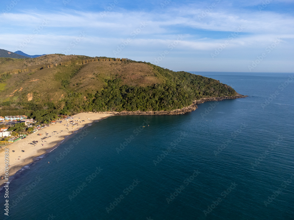 Fototapeta premium Beautiful village surrounded by nature and tropical beach