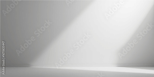 Smooth gray metallic texture with a brushed steel pattern on an empty white wall in a lit room, creating a shiny silver backdrop