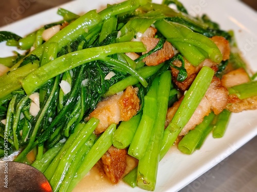 Vegetable fried with crispy pork