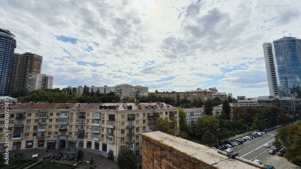 Fototapeta premium Architectural contrast in Kyiv — modern skyscrapers next to old historical buildings