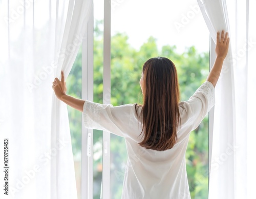 Woman opening curtains, enjoying fresh air (1) Free Download Woman opening curtains, enjoying fresh air (1) - GFXLoad