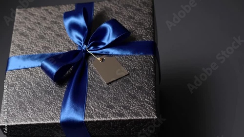 Costly offering for affluent gentlemen on somber backdrop premium luxurious surprise for wealthy males on dark setting professionally packaged item worthy present for anniversary paternal day romanti