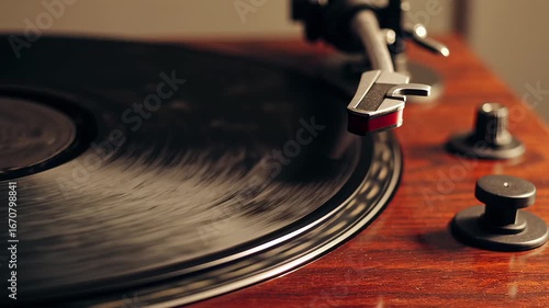 Wallpaper Mural This video captures a close-up of a spinning vinyl record on a classic wooden turntable. The stylus gently glides over the grooves, evoking nostalgia and showcasing the warm, analog sound experience o Torontodigital.ca