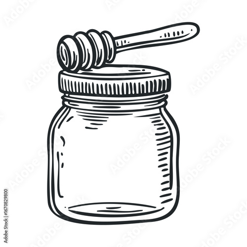 Jar of honey with a wooden dipper for cooking and baking