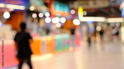 Wallpaper Mural A blurry image of a busy shopping mall with people walking around Torontodigital.ca