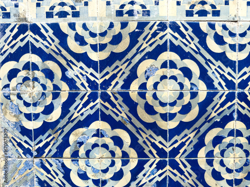 Traditional Portuguese Azulejo tiles with intricate blue and white patterns adorn a wall, showcasing historical artistry and cultural heritage