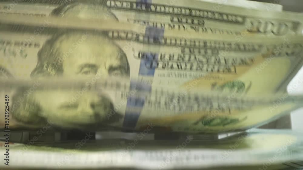 Macro shot counter counting dollar bills. Money counting machine with 100 dollar banknotes. Bank currency and finance. Close up cash money dollars counting. Crisis business, inflation concept.