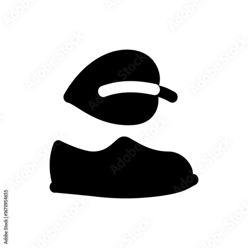 Illustration of a black loafer shoe with a leaf above it in a simple and minimalist style design