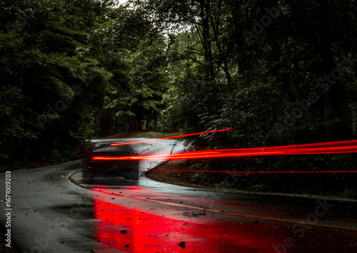 car tail lights after a rain storm