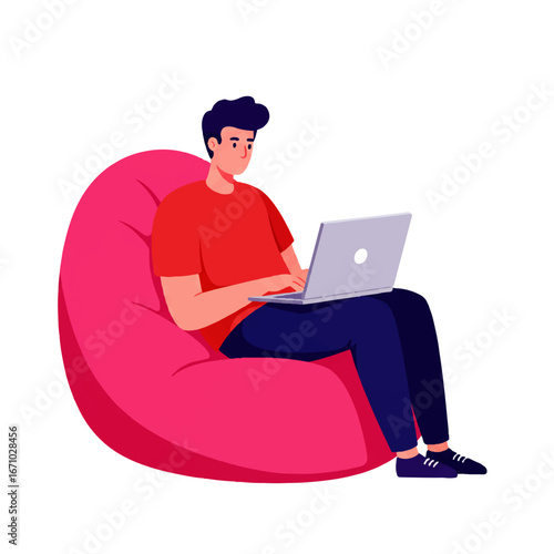 A young man sits comfortably in a pink beanbag chair, working on a laptop computer.