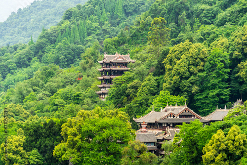 Wallpaper Mural Traditional buildings nestled in a vibrant green forest in Dujiangyan, Sichuan, China. Torontodigital.ca