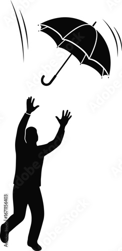 Silhouette of a man trying to catch an umbrella falling from sky