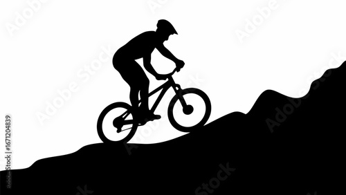 Silhouette of a mountain biker riding uphill on a trail with a helmet and mountain landscape view scene