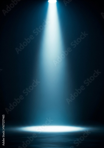 Bright blue spotlight beam illuminating a dark stage floor
