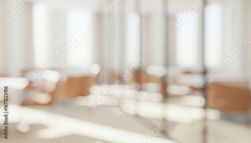 Blurred office interior with chairs and tables in a bright airy space, emphasizing minimal modern atmosphere with open clean layout and professional design.
