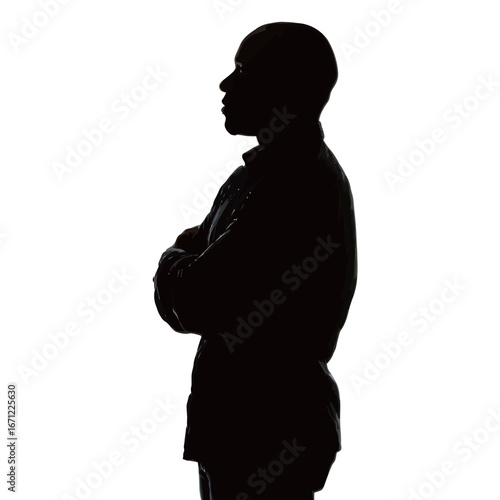 A person stands with arms crossed in a confident pose. The silhouette contrasts sharply with a bright white background, creating a striking visual effect.
