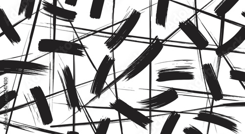 Abstract pattern of scattered black paint brush strokes, white background