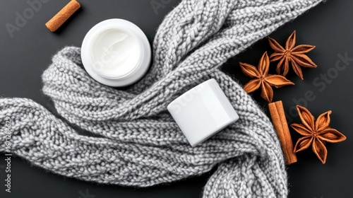 Cozy winter skincare essentials: nourishing cream with warm spices and knitted comfort