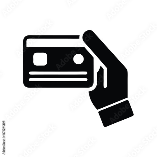 A black hand firmly holds a credit card for payment processing concept