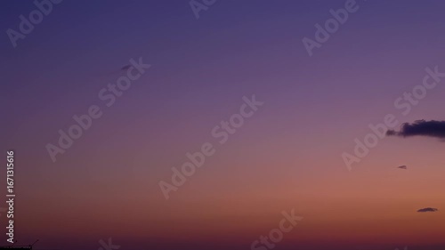 Serene Sunset:  Pastel Hues and Drifting Clouds