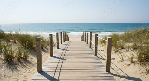 A Wooden Boardwalk Path Leading Through Sand Dunes To Ocean