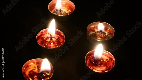 Hand made oil lamps decorated with Rangoli in the festive night of Hindu festival Diwali or Deepavali