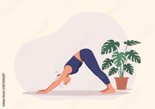 Serene woman practicing yoga downward dog pose at home, finding inner peace with lush plant