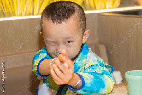 a little boy looking at camera