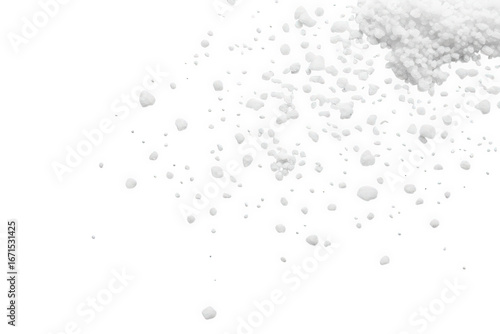 Scattered sea salt grains isolated on transparent background, top view, studio shot