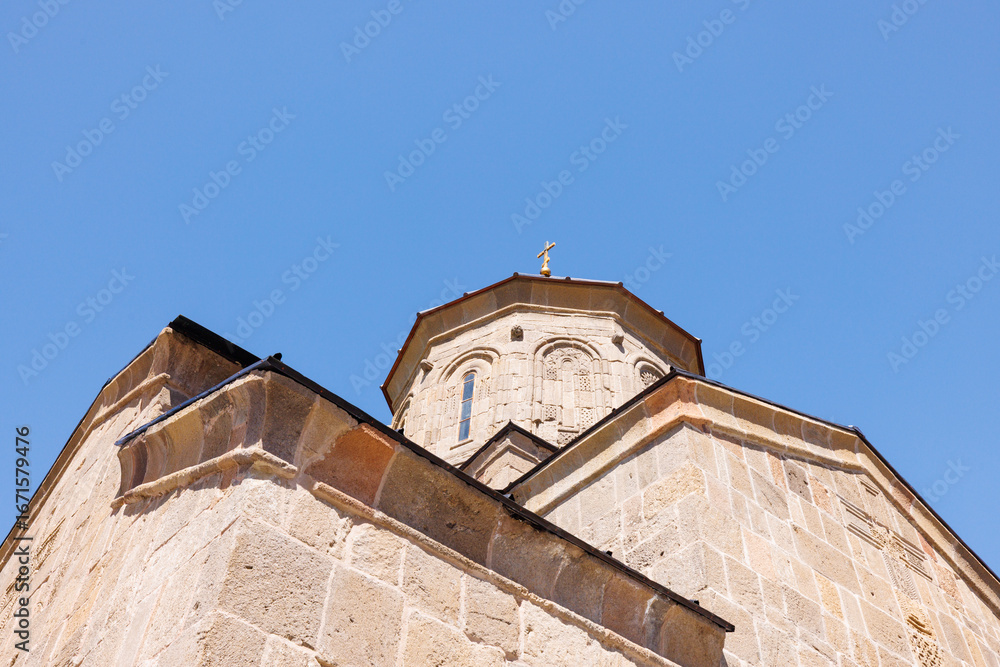Fototapeta premium Scenic view of the Gergeti Trinity Church in the Caucasus Mountains, northern Georgia