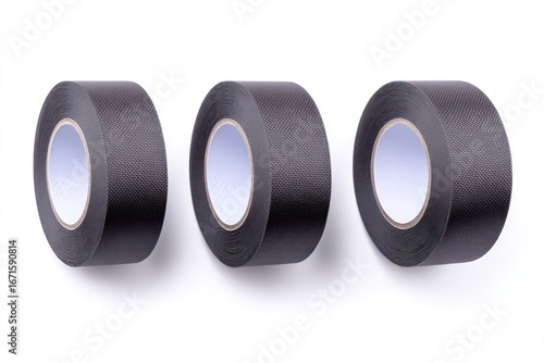 Three rolls of black electrical tape arranged in a row on a white surface, casting subtle shadows