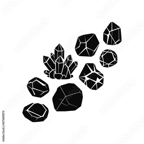 Collection of black geometric crystals and minerals with sharp edges on white background