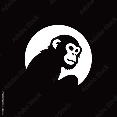 A striking black and white design features a monkeys silhouette alongside a glowing full moon, creating a bold visual impact. The simplicity enhances the overall effect.