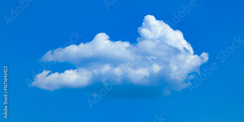 A raster image of a single cloud photographed against a blue sky. Easy relaxed cottony shape. Background quiet sky. Fiber contours after rain. Lonely free substance water. Trivial form of freedom.