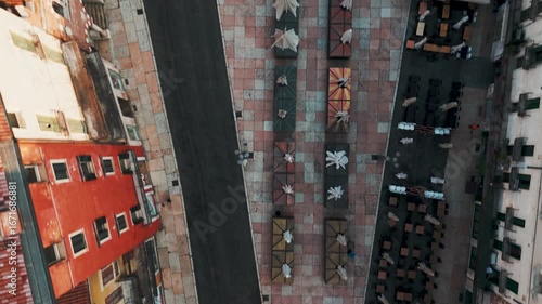 Aerial Drone Top Down Shot Of Piazza Delle Erbe In Verona, Italy Just After Sunrise On A Bright Summer Morning.