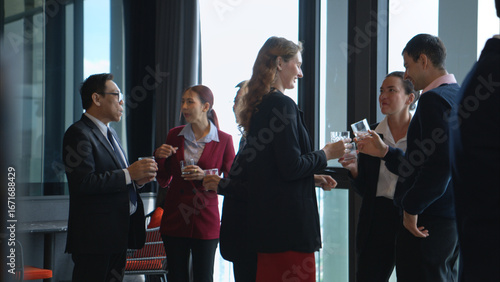 Business professionals networking and enjoying drinks at a corporate event