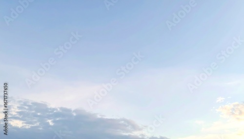 Pale blue sky with thin, wispy clouds near the horizon