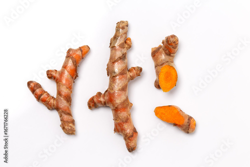 Dry Turmeric powder and turmeric root isolated on white background ,Top view