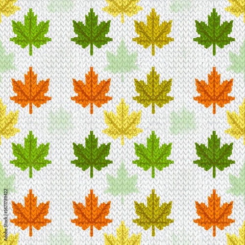 A cheerful autumnal pattern of maple leaves in various colors, nestled in a knitted fabric backdrop.